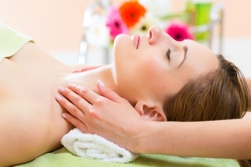 Wellness - woman getting head massage in Spa