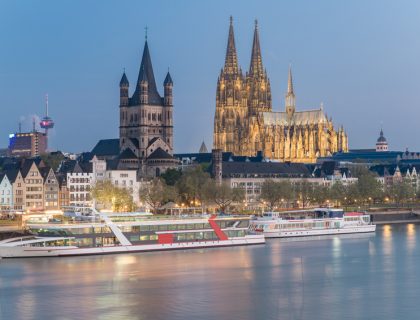 Aerial view over the Rhine River with cruise ship in Cologne, Ge